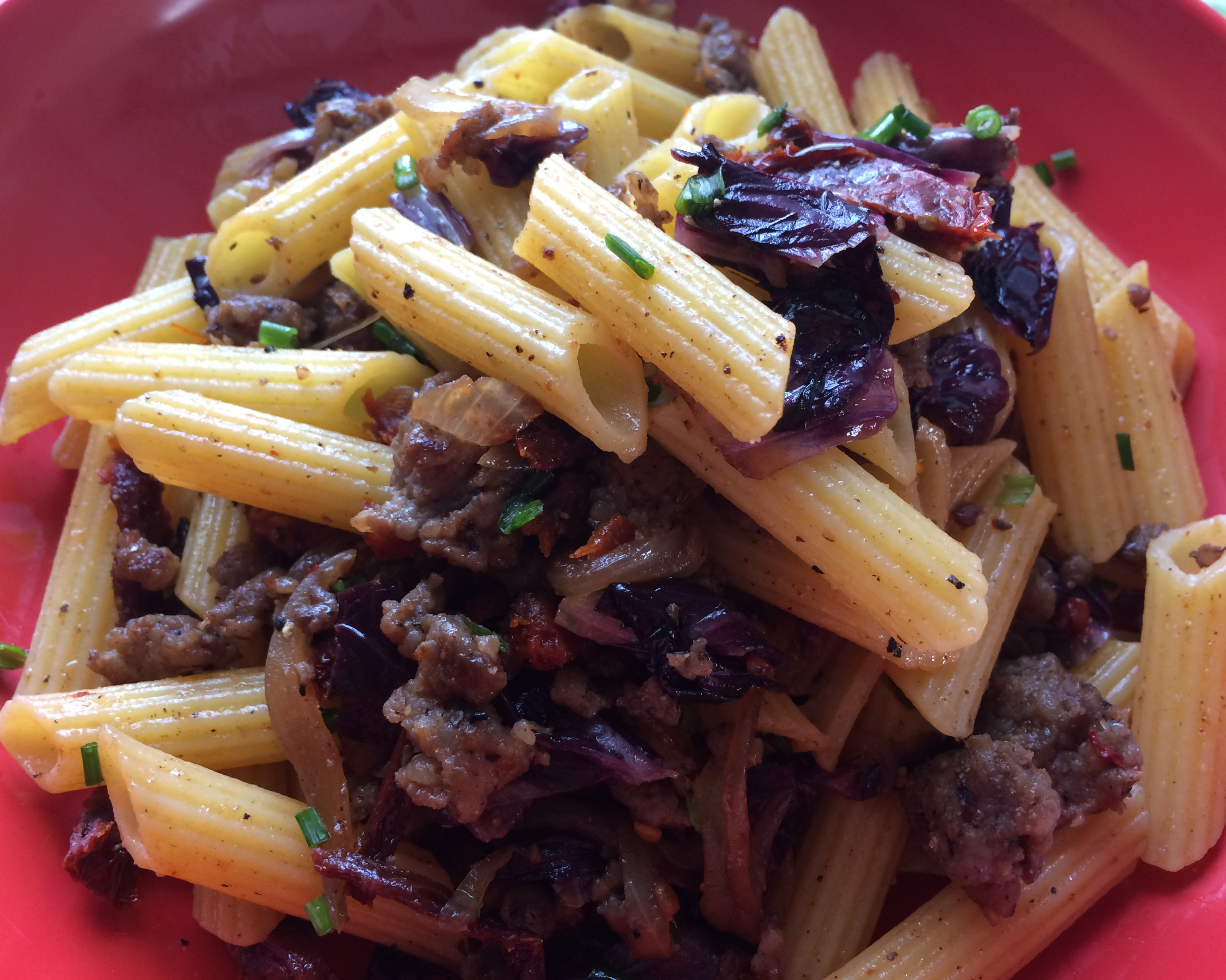 Gluten-free penne with Italian sausage, caramelized onions and radicchio